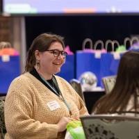 person standing and smiling photo 2